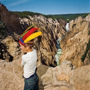 Boy with Feathered Headdress at Lower Falls Overlook, Yellowstone National Park, Wyoming
