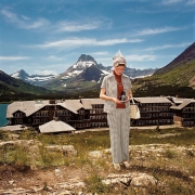 Woman Taking Photograph at Many Glacier Hotel, Glacier National Park, Montana