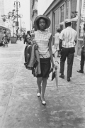 Young woman in a hat on a city street, Detroit, 1968